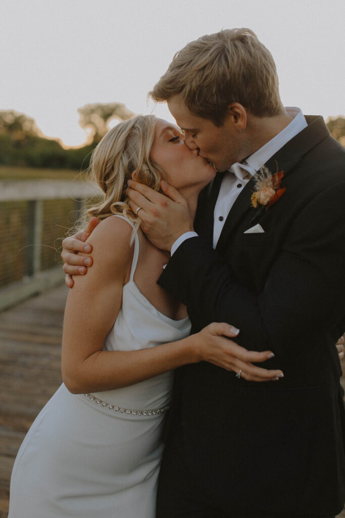 bride and groom at sunset looking at each other and smiling for the wedding photography narrative