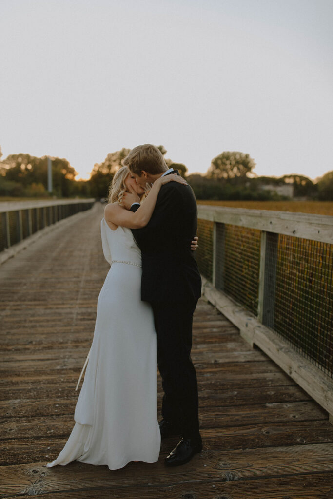 bride and groom at sunset looking at each other and smiling for the wedding photography narrative