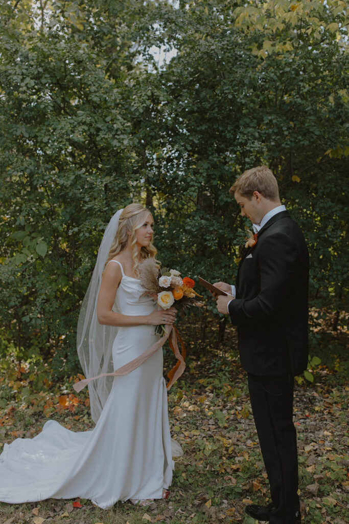 bride and groom shot of them looking at each other 