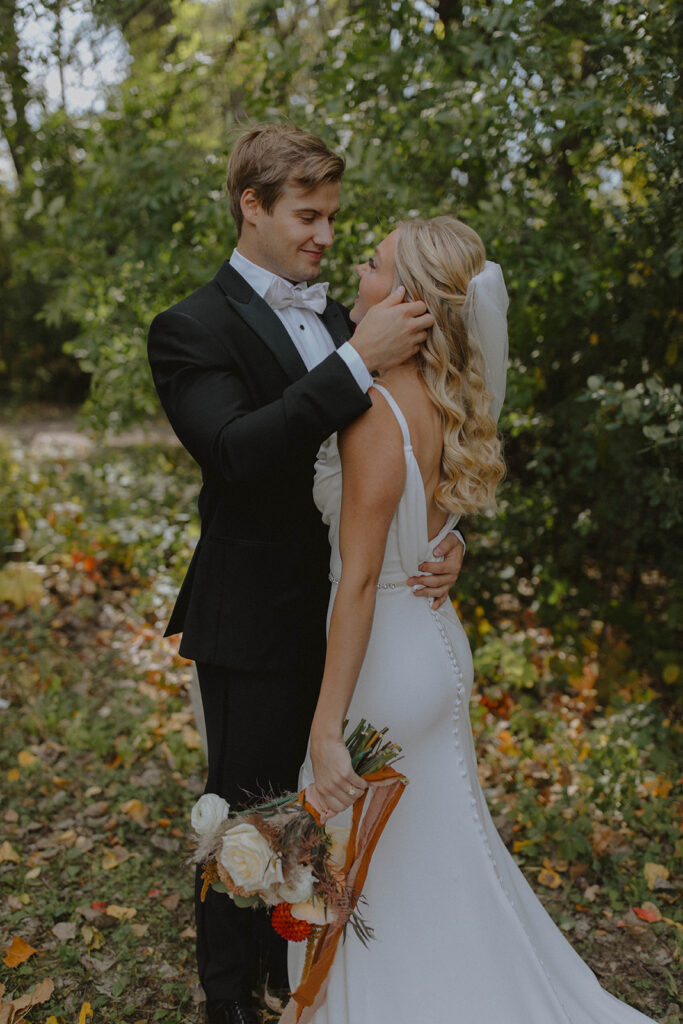 bride and groom shot of them looking at each other 